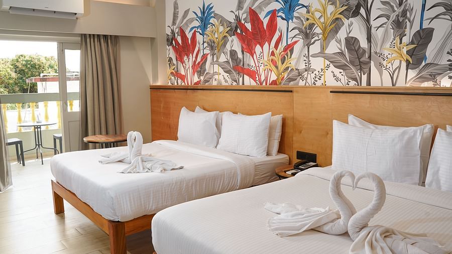Two beds in Urban Corner Room at Indie Stays Resort, Goa